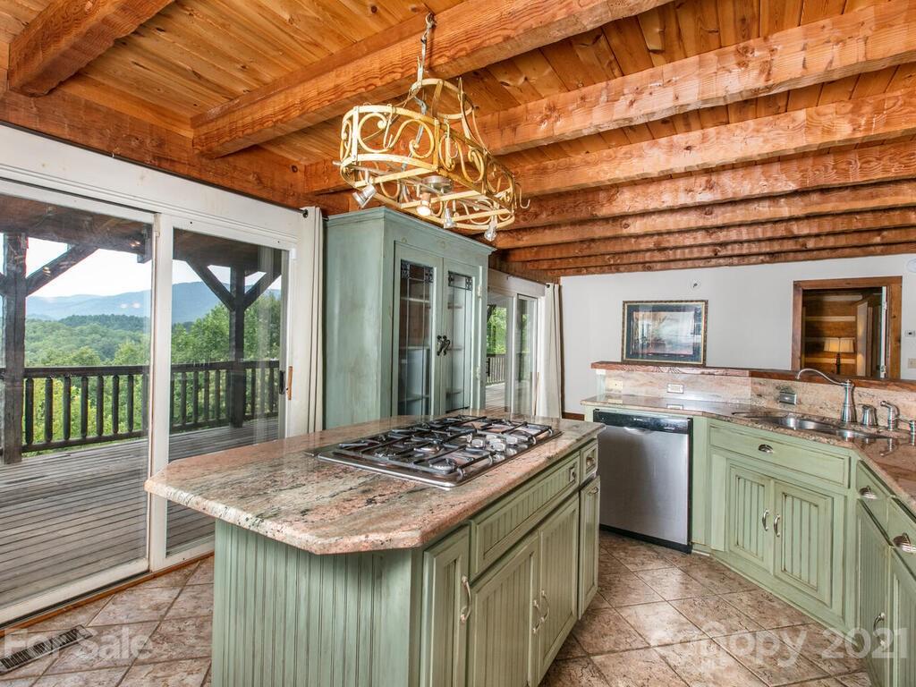 723 North Highland Road, Unit 9 10 11 Mill Spring, NC 28756 - Photo 31 of 46 a kitchen that has a lot of cabinets in it