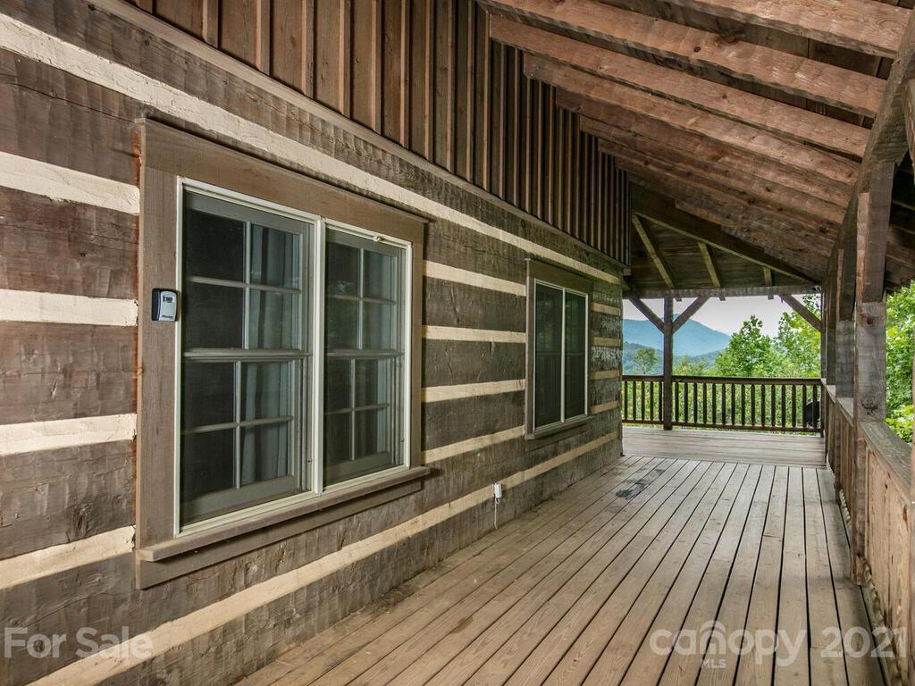 723 North Highland Road, Unit 9 10 11 Mill Spring, NC 28756 - Photo 39 of 46 a view of a balcony with door and wooden floor