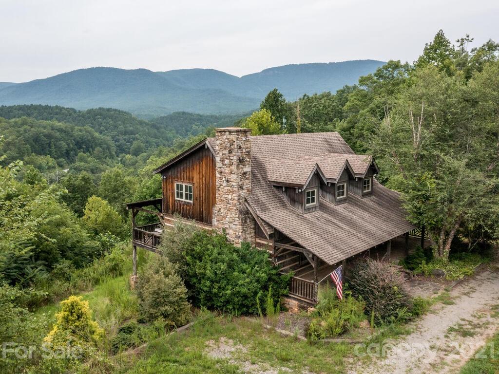 723 North Highland Road, Unit 9 10 11 Mill Spring, NC 28756 - Photo 5 of 46 an aerial view of a house with mountain view in back