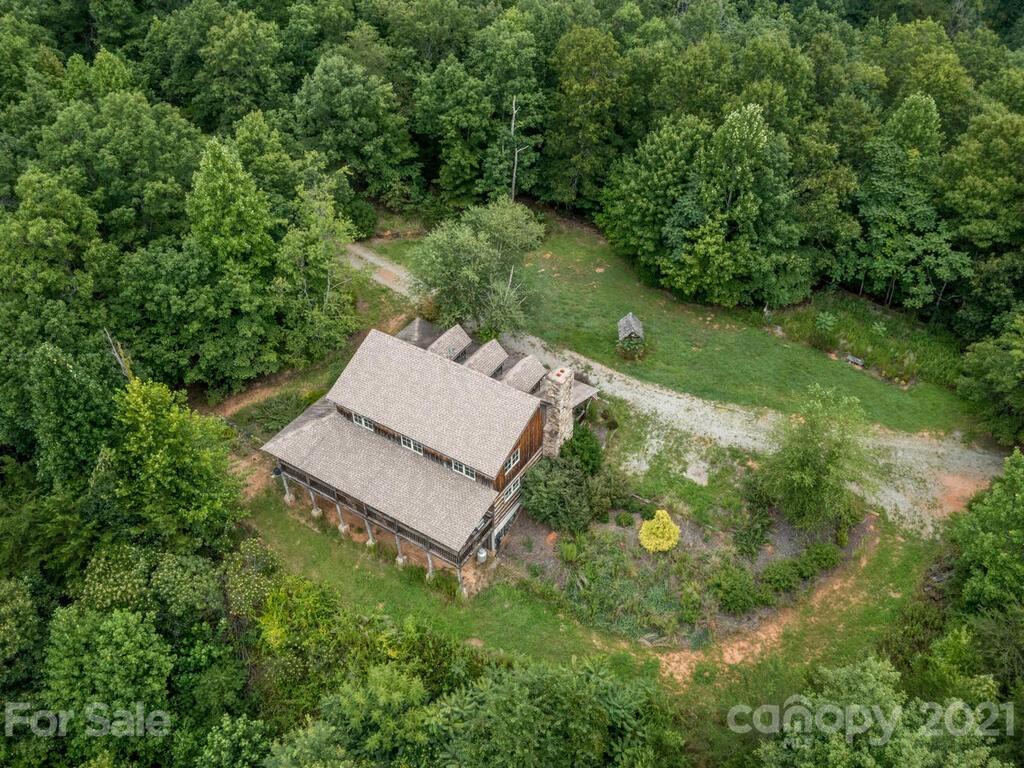 723 North Highland Road, Unit 9 10 11 Mill Spring, NC 28756 - Photo 41 of 46 an aerial view of a house with a yard