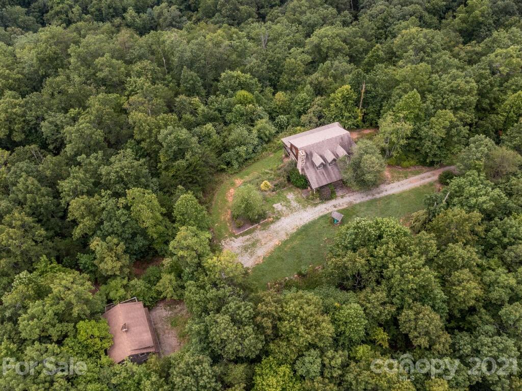 723 North Highland Road, Unit 9 10 11 Mill Spring, NC 28756 - Photo 45 of 46 an aerial view of a house with a yard