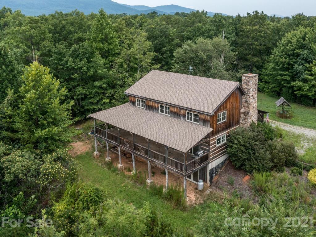 723 North Highland Road, Unit 9 10 11 Mill Spring, NC 28756 - Photo 7 of 46 an aerial view of a house with a yard