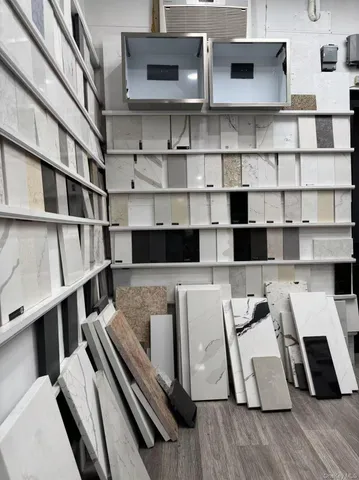 a view of a living room with furniture and wooden floor