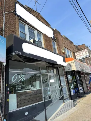 a view of a building with sitting area