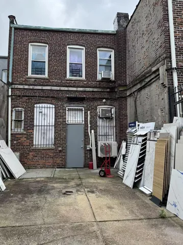a front view of a house with stairs