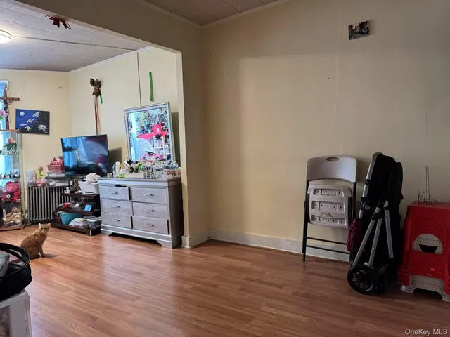 a view of a workspace with furniture and wooden floor