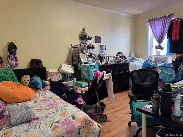 a bedroom with furniture and a window