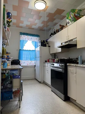 a kitchen that has a sink and a stove