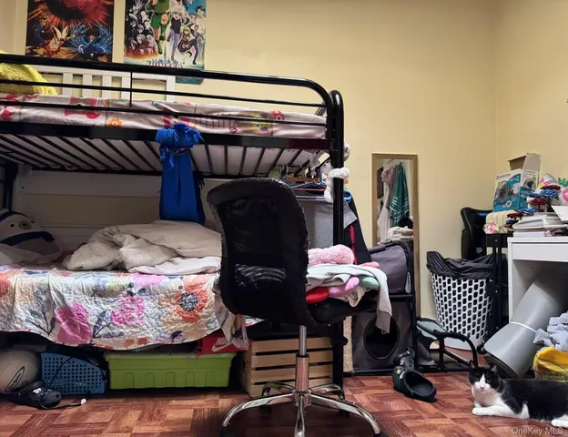 a bedroom with bed and a window