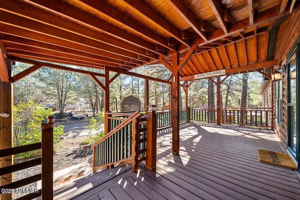 2421 West Thornton Road Show Low, AZ 85901 - Photo 8 of 48 a view of a porch with wooden floor