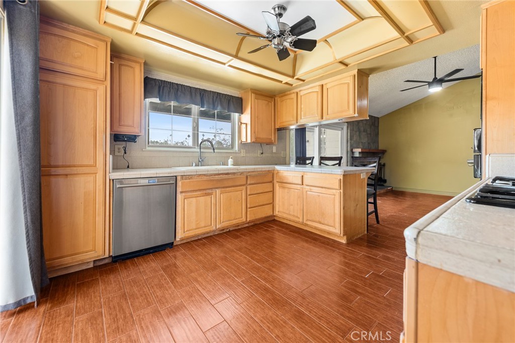 3208 Gibraltar Dr. Riverside, CA 92506 - Photo 13 of 37 a kitchen with stainless steel appliances granite countertop a sink a stove and refrigerator