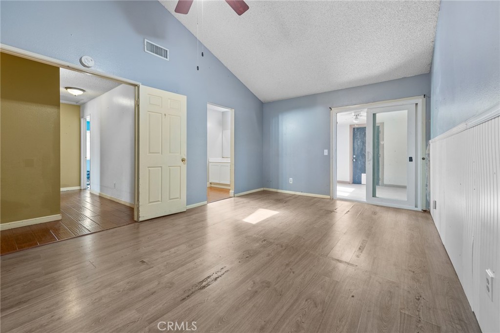 3208 Gibraltar Dr. Riverside, CA 92506 - Photo 16 of 37 an empty room with wooden floor and windows
