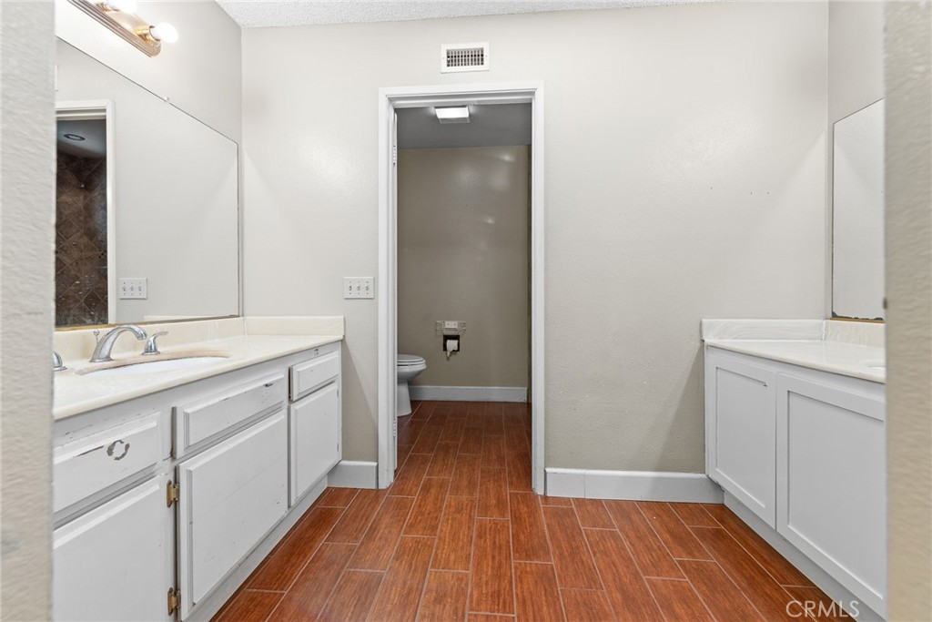3208 Gibraltar Dr. Riverside, CA 92506 - Photo 20 of 37 a bathroom with a sink and a mirror