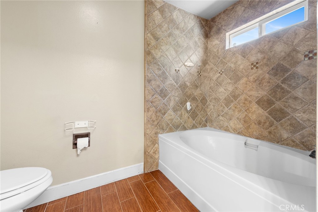 3208 Gibraltar Dr. Riverside, CA 92506 - Photo 21 of 37 a white bath tub sitting next to a toilet