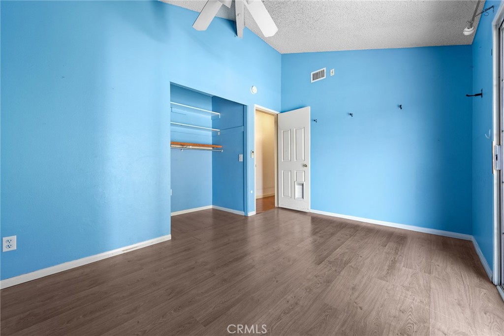 3208 Gibraltar Dr. Riverside, CA 92506 - Photo 27 of 37 a view of an empty room with wooden floor
