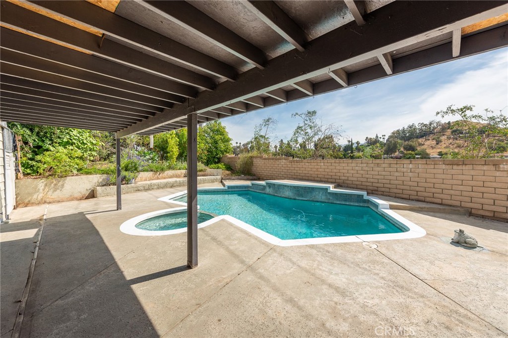 3208 Gibraltar Dr. Riverside, CA 92506 - Photo 30 of 37 a view of a swimming pool with a patio