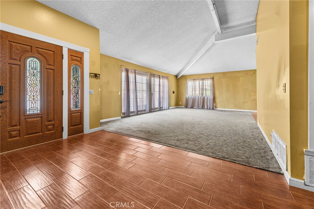 3208 Gibraltar Dr. Riverside, CA 92506 - Photo 6 of 37 a view of a livingroom with wooden floor and a bathroom
