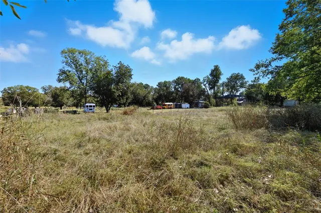a view of lake with green space