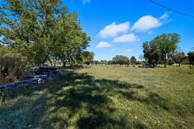 a view of lake with green space