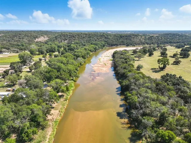 a view of a yard with trees