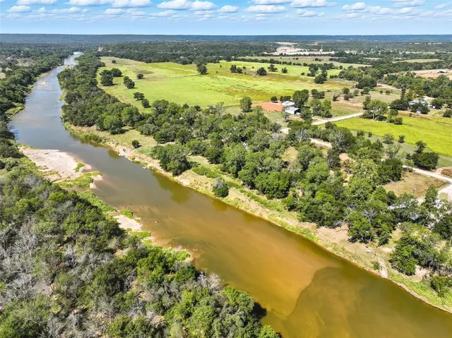 a view of wall with green space