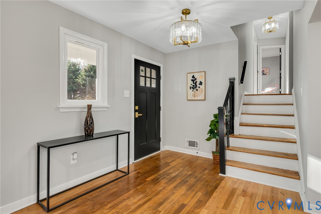 8513 Spring Hollow Drive Richmond, VA 23227 - Photo 15 of 49 a view of entryway and hall with wooden floor