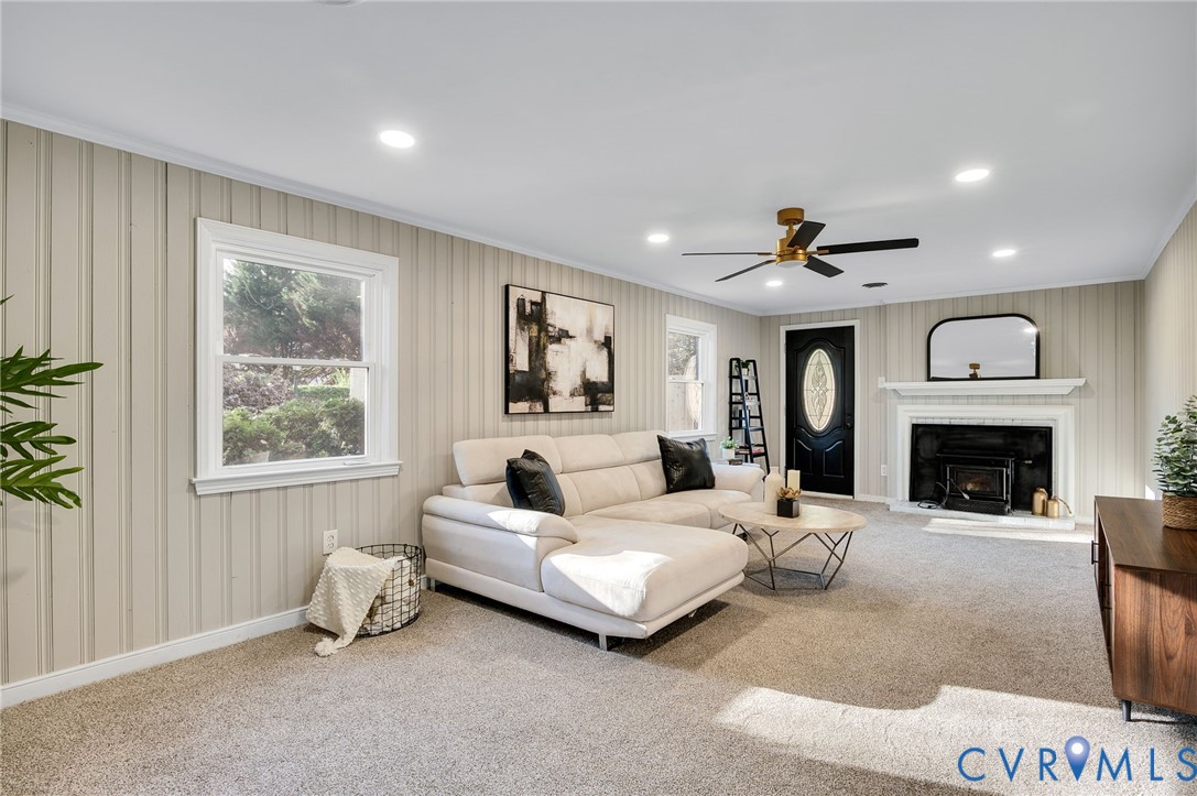 8513 Spring Hollow Drive Richmond, VA 23227 - Photo 16 of 49 a living room with furniture and a fireplace