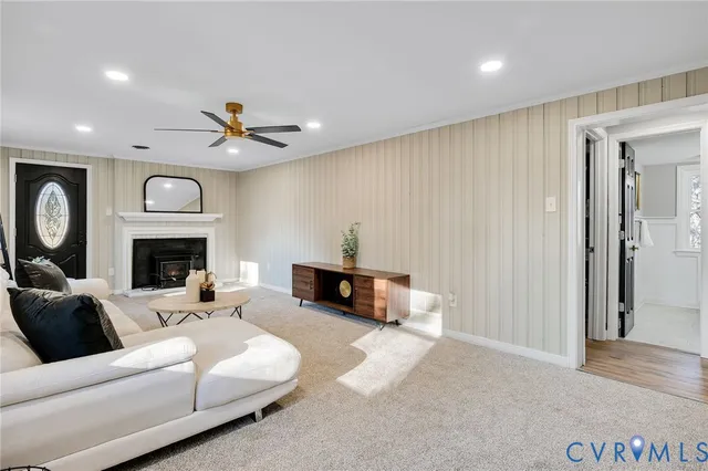 a living room with furniture and a fireplace