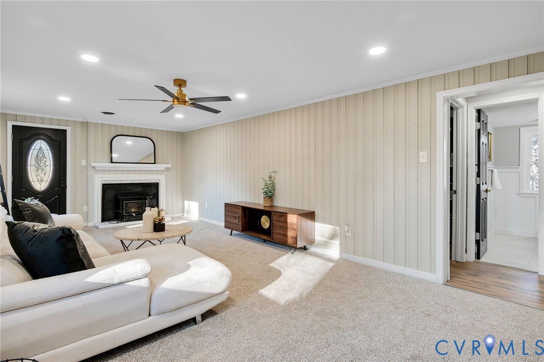 8513 Spring Hollow Drive Richmond, VA 23227 - Photo 17 of 49 a living room with furniture and a fireplace
