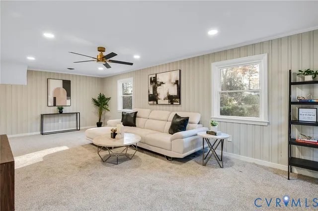 a living room with furniture and a window