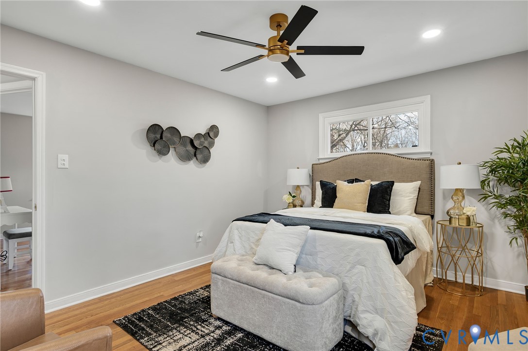 8513 Spring Hollow Drive Richmond, VA 23227 - Photo 23 of 49 a bedroom with a bed and a painting on the wall