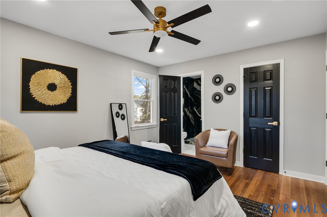 8513 Spring Hollow Drive Richmond, VA 23227 - Photo 24 of 49 a bedroom with a bed and a painting on the wall
