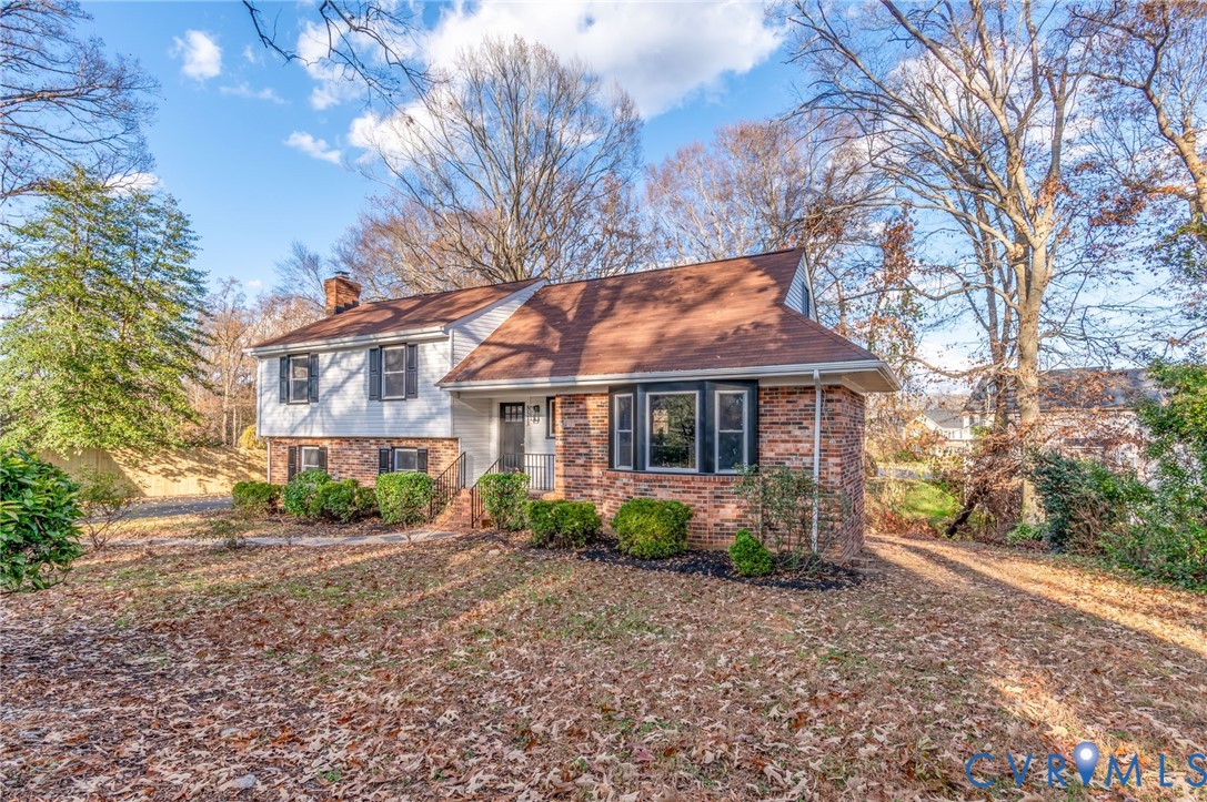 8513 Spring Hollow Drive Richmond, VA 23227 - Photo 38 of 49 a front view of a house with a yard