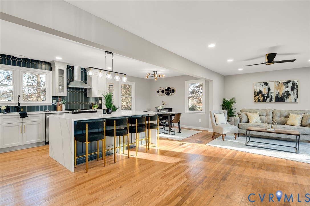8513 Spring Hollow Drive Richmond, VA 23227 - Photo 6 of 49 a living room with furniture a large window and wooden floor
