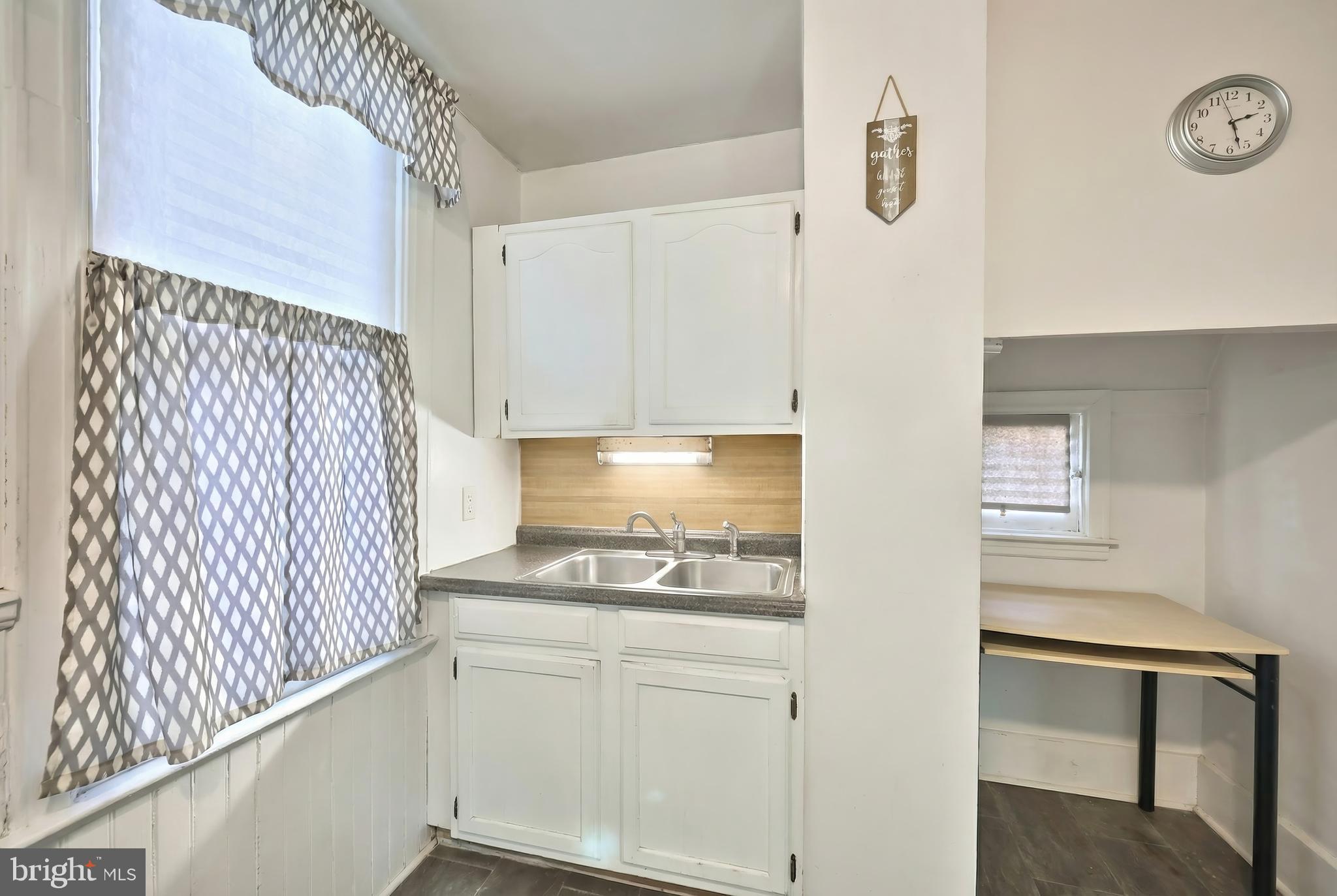 381 Simpson Street York, PA 17403 - Photo 11 of 21 a kitchen with a refrigerator and white cabinets