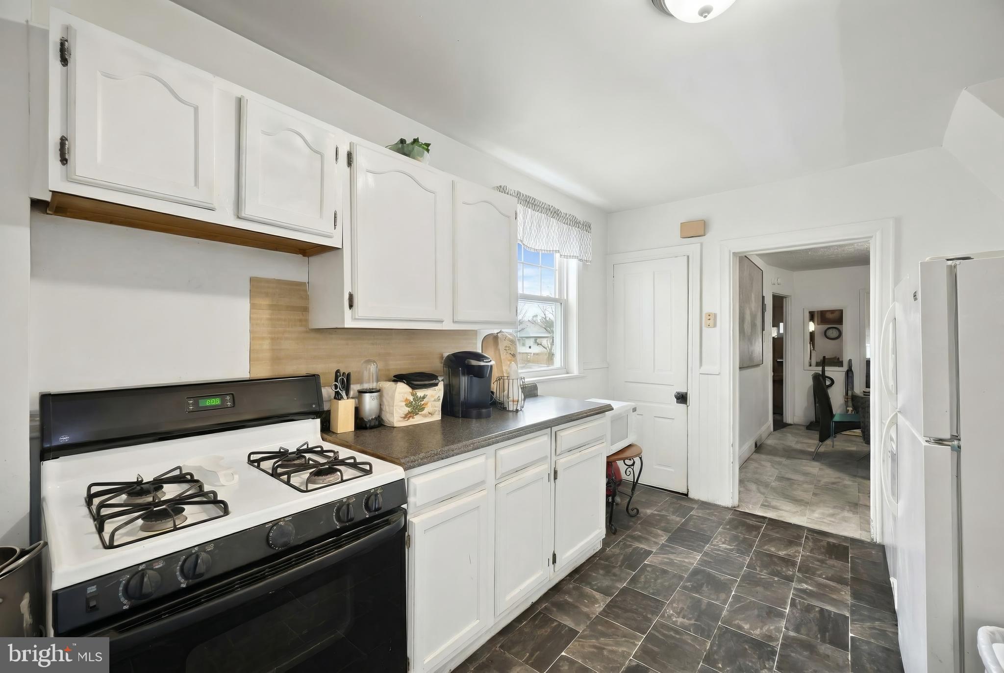 381 Simpson Street York, PA 17403 - Photo 12 of 21 a kitchen with a stove and a refrigerator