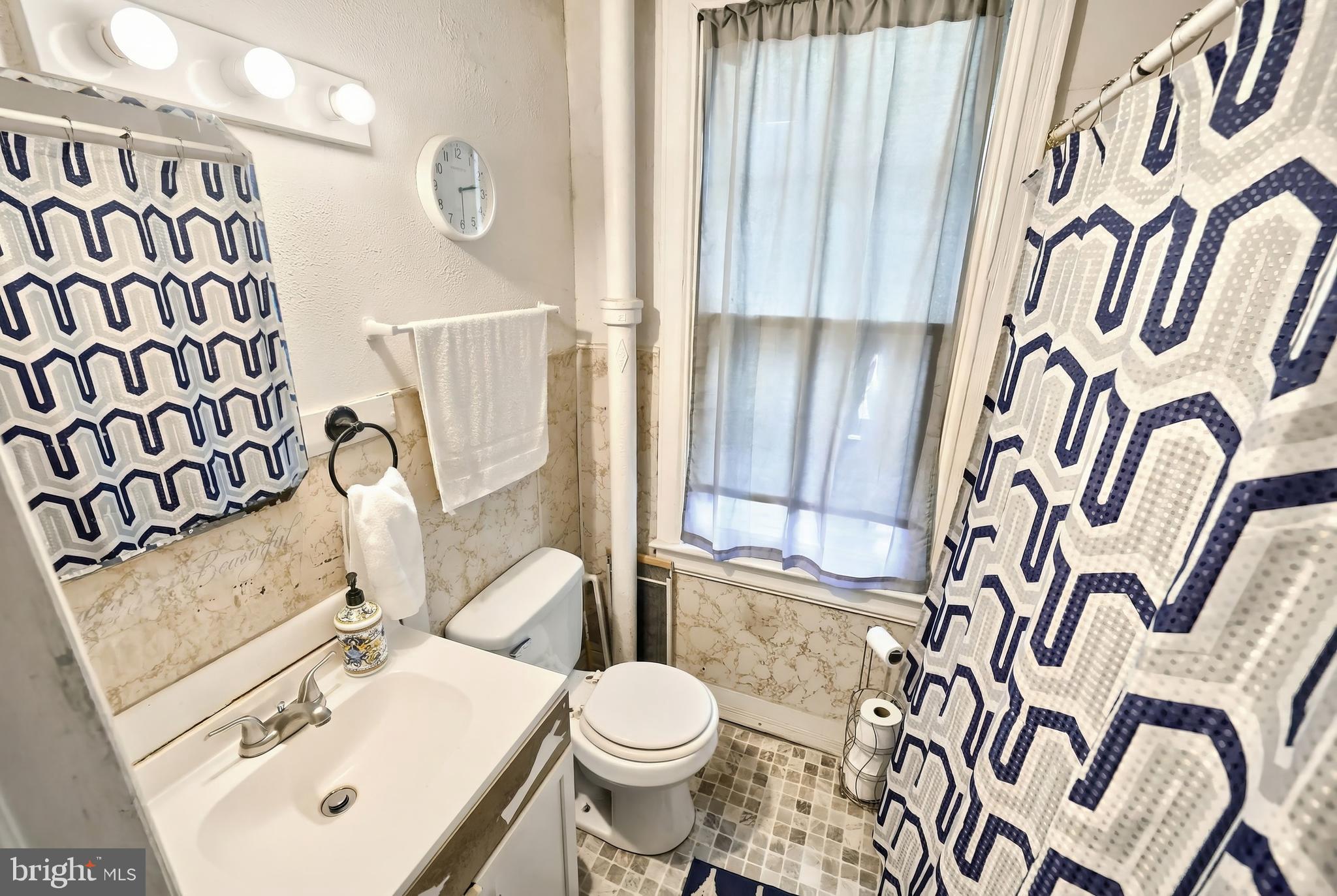 381 Simpson Street York, PA 17403 - Photo 15 of 21 a white toilet sitting next to a bathroom sink