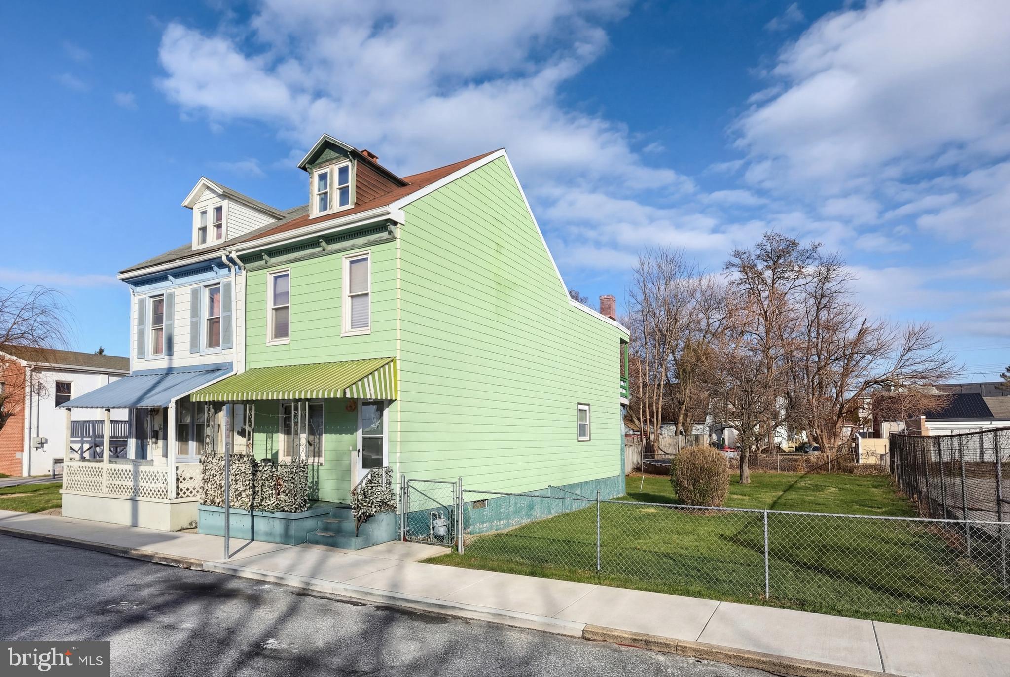 381 Simpson Street York, PA 17403 - Photo 3 of 21 a front view of a house with a garden