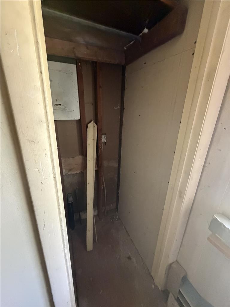 5114 Three Lakes Road New Milford, PA 18834 - Photo 36 of 55 An unfinished storage closet reveals exposed studs and framing alongside drywall sheets.