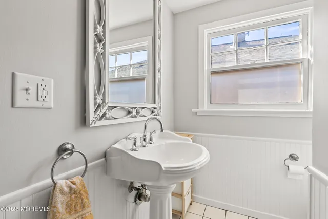 a bedroom with a bed and a lamp