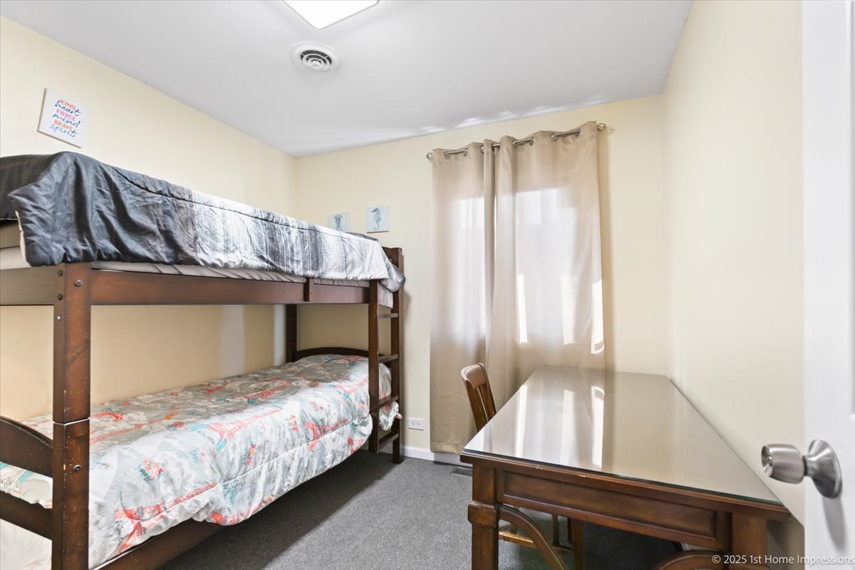 16340 Justine Street Markham, IL 60428 - Photo 12 of 19 a bedroom with a bed and window