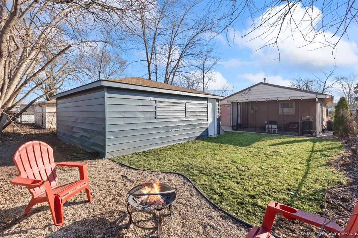 16340 Justine Street Markham, IL 60428 - Photo 15 of 19 a backyard of a house with table and chairs