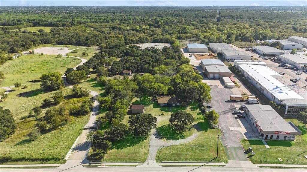 9090 Teasley Lane Denton, TX 76210 - Photo 1 of 1 an aerial view of residential houses with outdoor space and street view