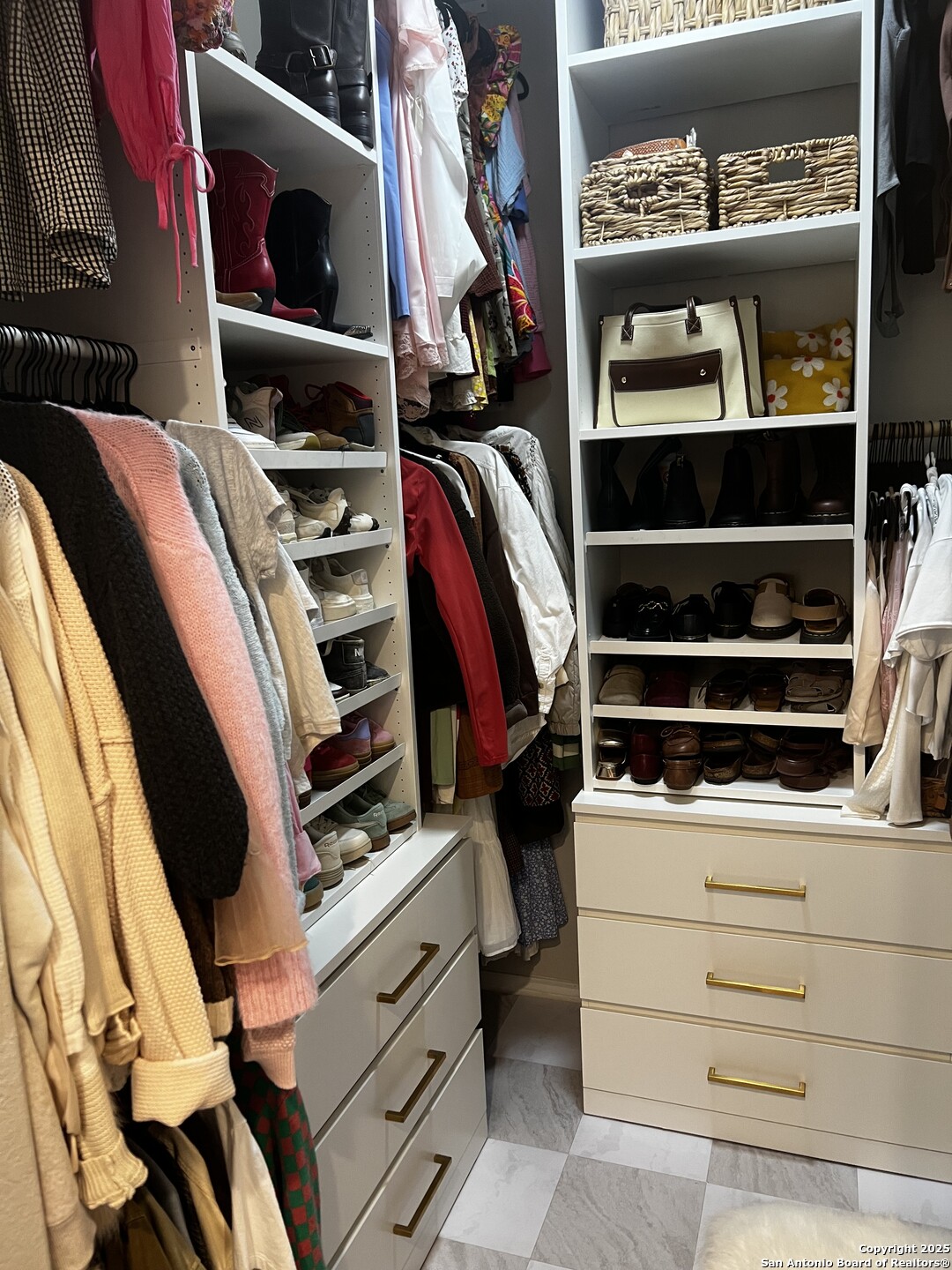 7602 Alameda Beach Converse, TX 78109 - Photo 14 of 23 a view of walk in closet with clothes and shoes