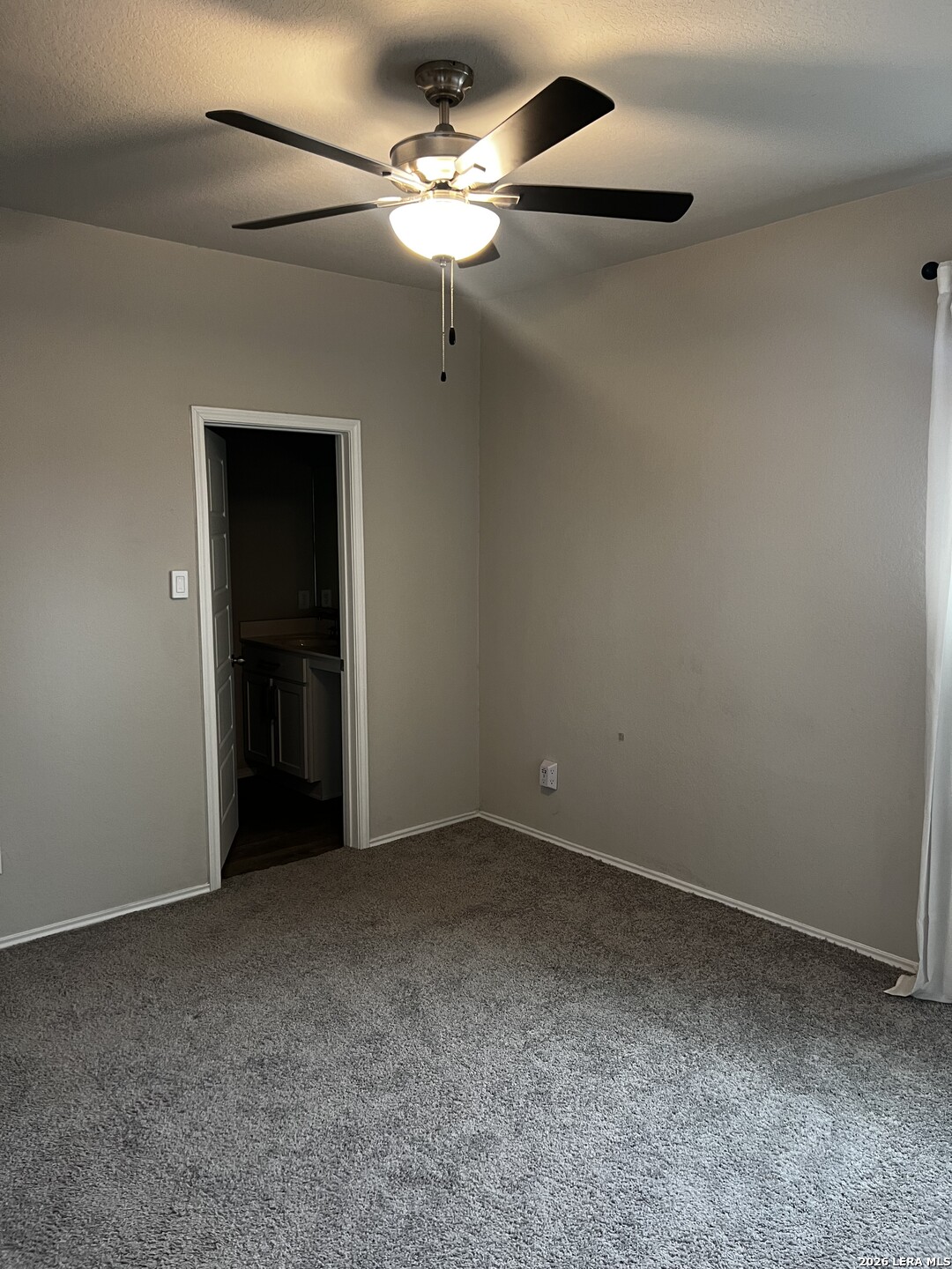 7602 Alameda Beach Converse, TX 78109 - Photo 17 of 39 a view of an empty room with a ceiling fan