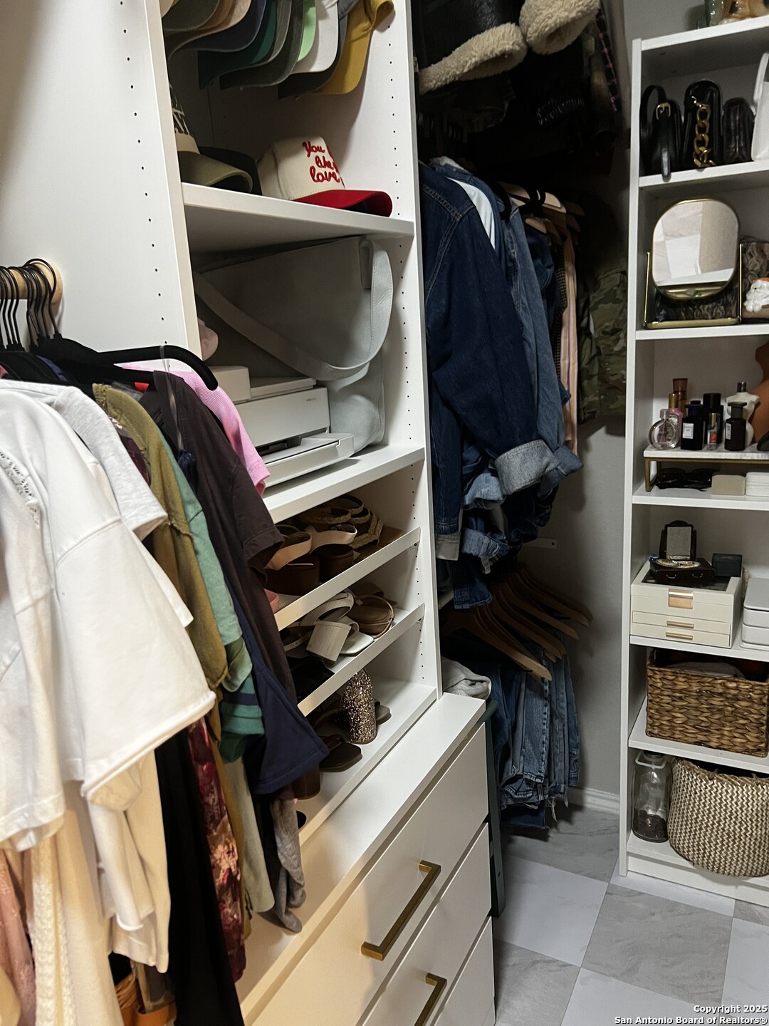 7602 Alameda Beach Converse, TX 78109 - Photo 24 of 39 a view of walk in closet with clothes and shoes