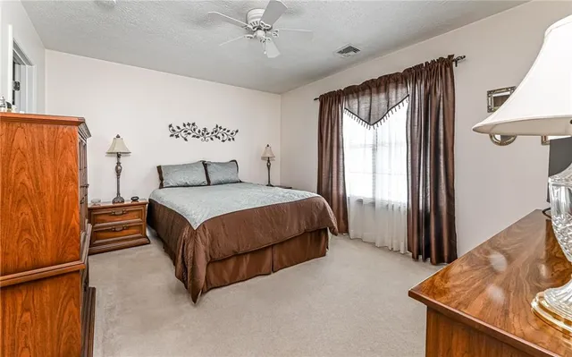 a bed room with a bed and a window