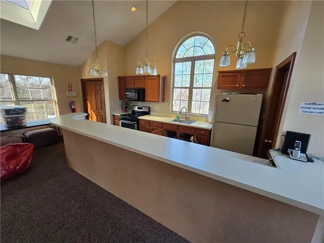 a living room with furniture a window and gym equipment