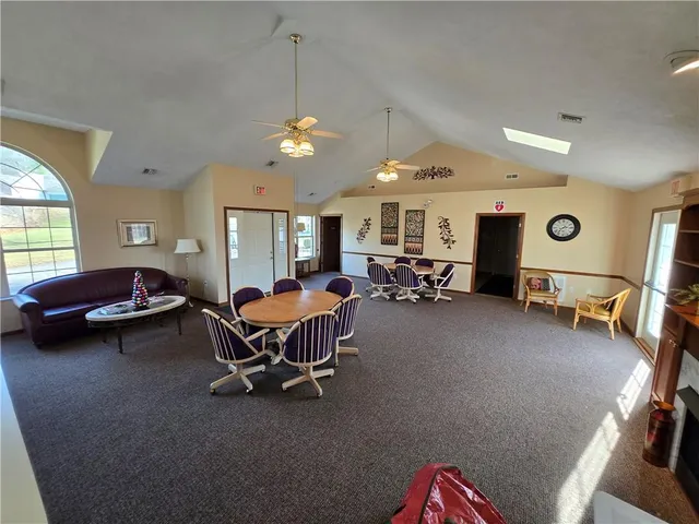 a dining room with furniture and window