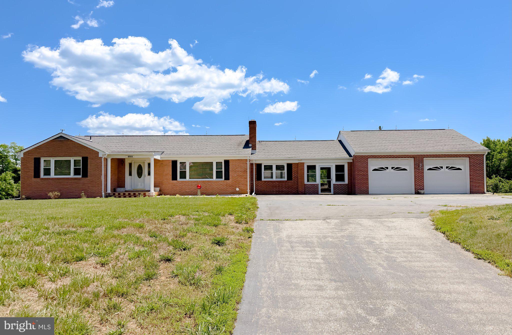 23230 Colton Point Road Avenue, MD 20609 - Photo 57 of 63 Charming brick home under blue skies.
